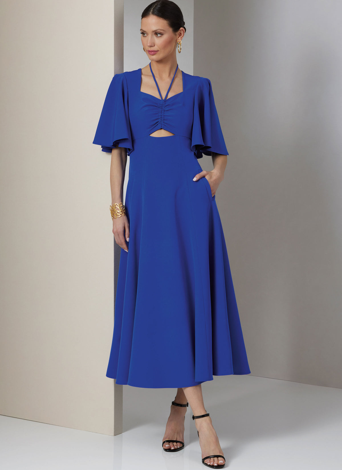 Vogue Patterns V2025 envelope showing fit and flare cut-out dress designs