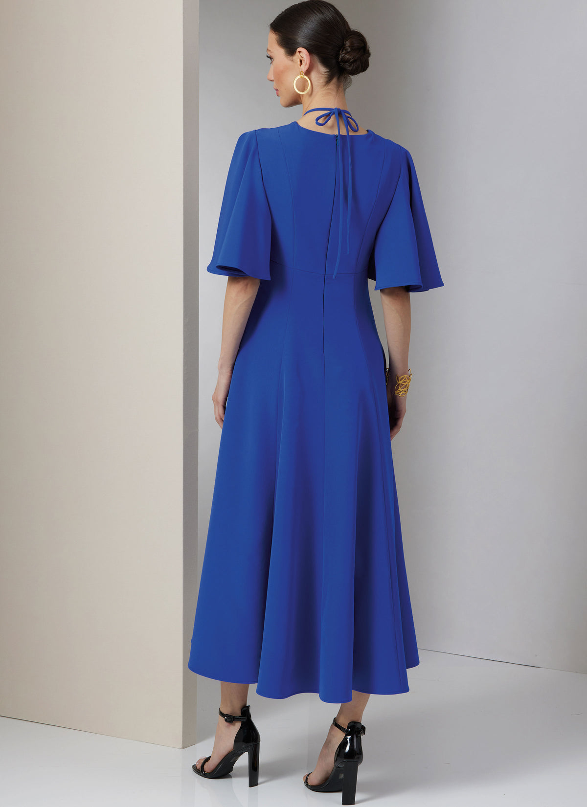 Vogue Patterns V2025 envelope showing fit and flare cut-out dress designs