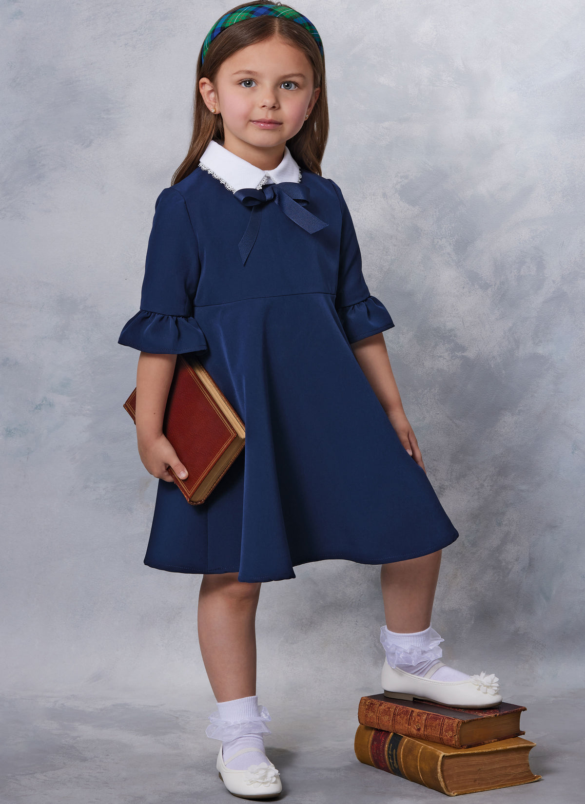 Vogue Patterns V2058 pattern envelope showing a lined girls' dress