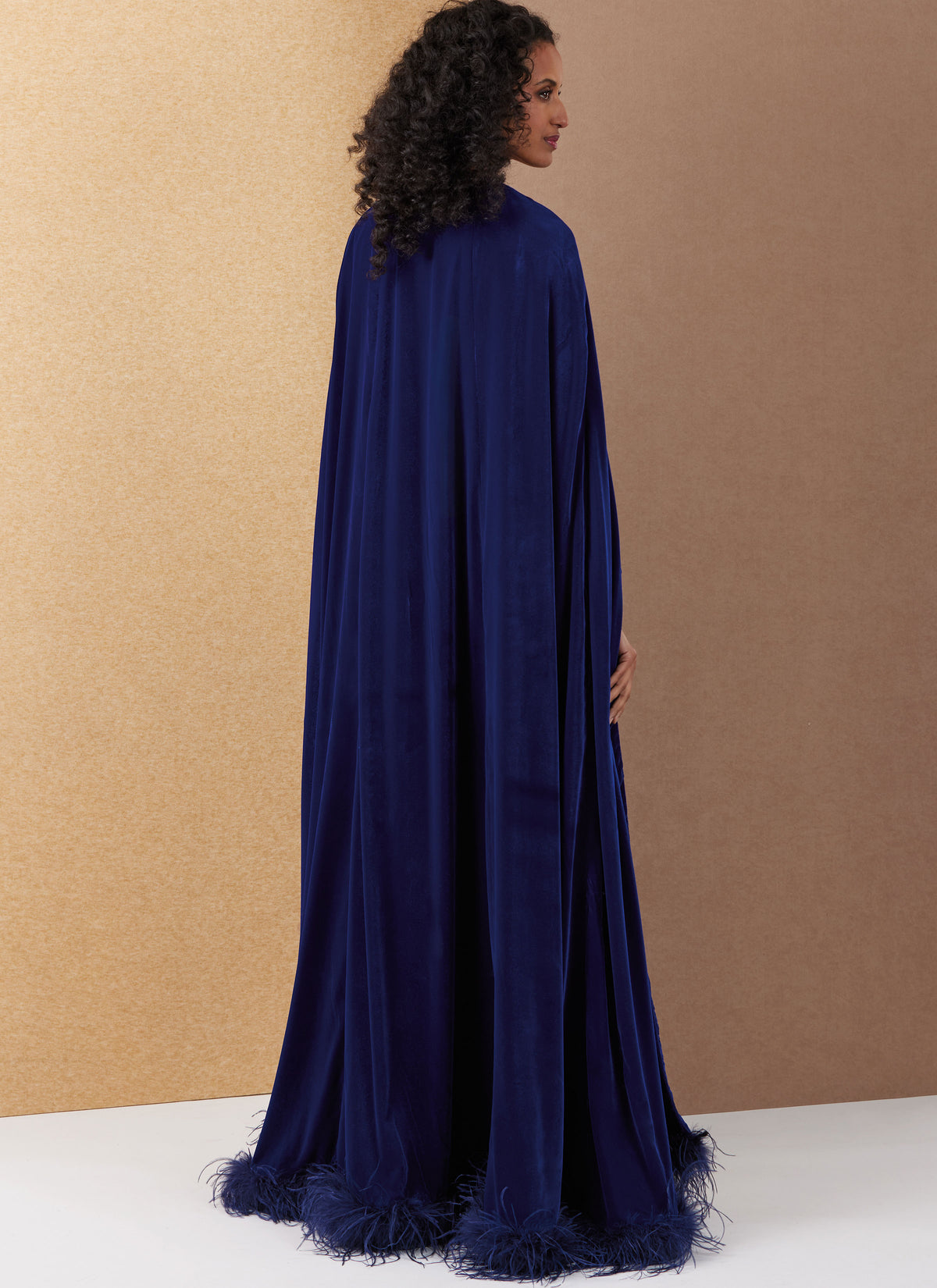 Vogue Patterns V2132 envelope showing the lined cape designs