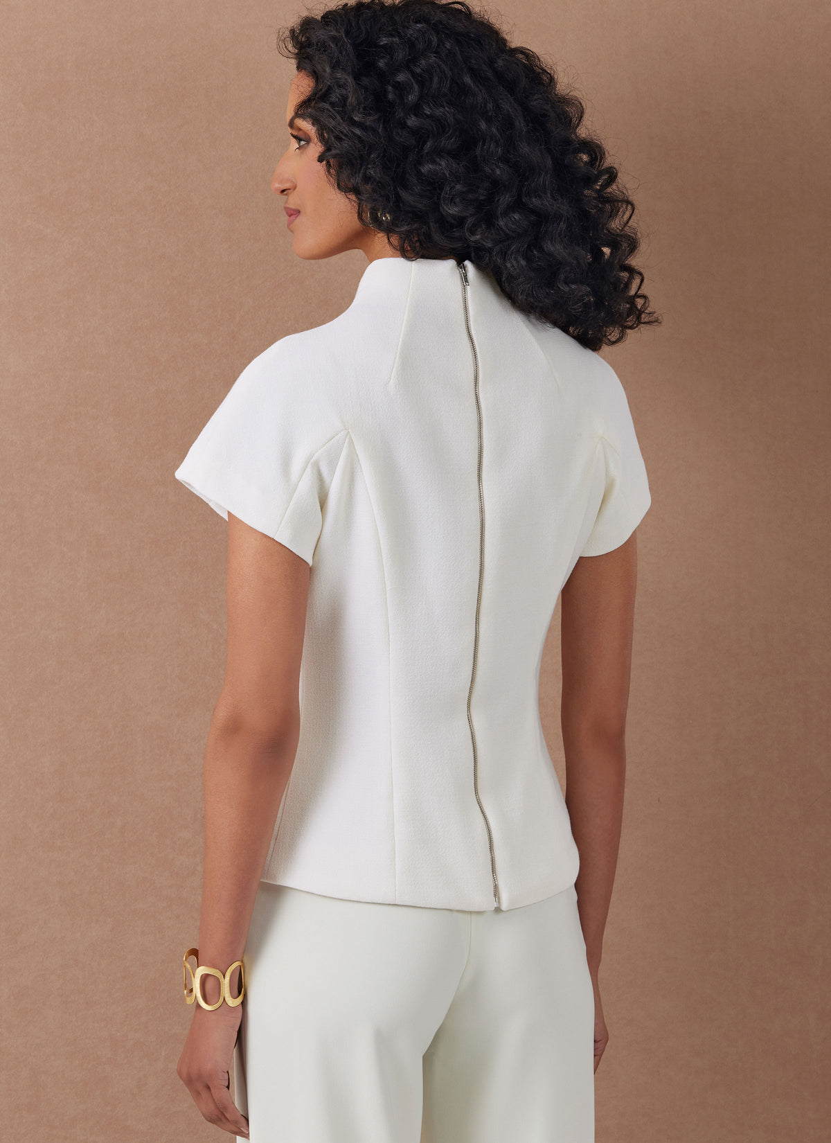 Vogue Patterns V2134 envelope showing the funnel neck top designs