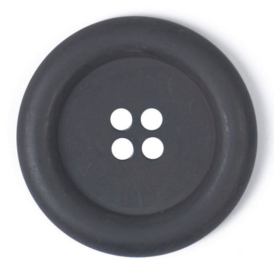 Large grey four-hole button with a wide rim