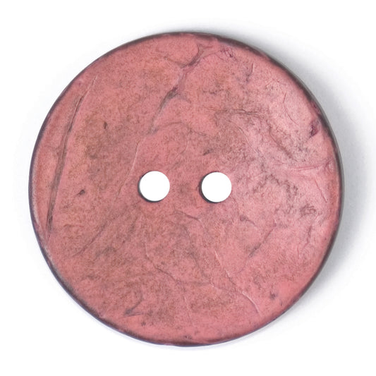 Close-up of a dusky pink round button, 30mm