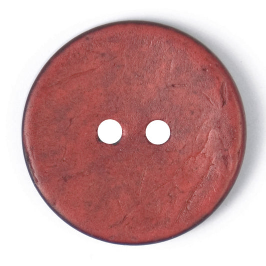 Close-up of brick red round buttons, 22mm