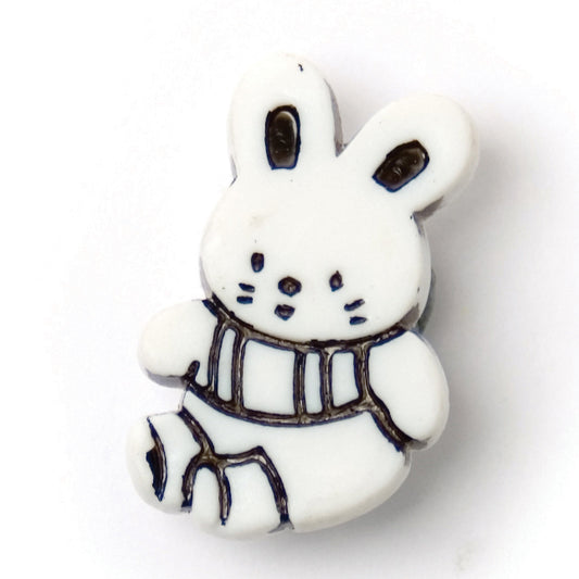 White rabbit-shaped novelty button with black detail, 21mm