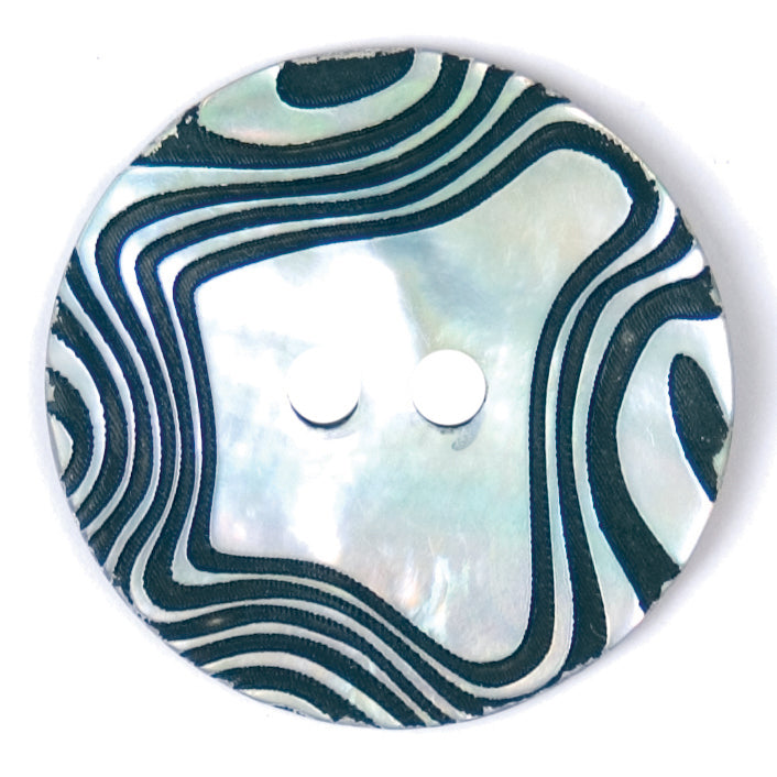 Pearlescent button with black swirl pattern and two holes