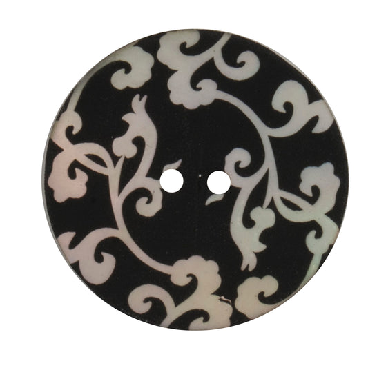 Black round two-hole button with a cream scroll pattern, 34mm