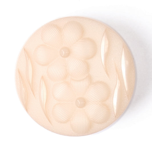 Round peach button with embossed flowers