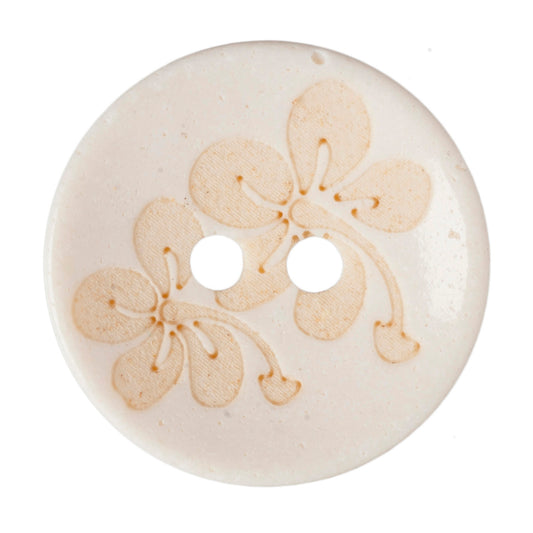 Cream button with a gold-tinted floral design