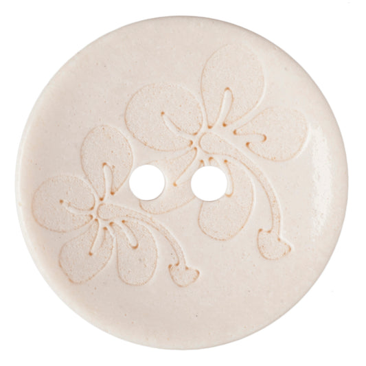 Cream button with an embossed floral design