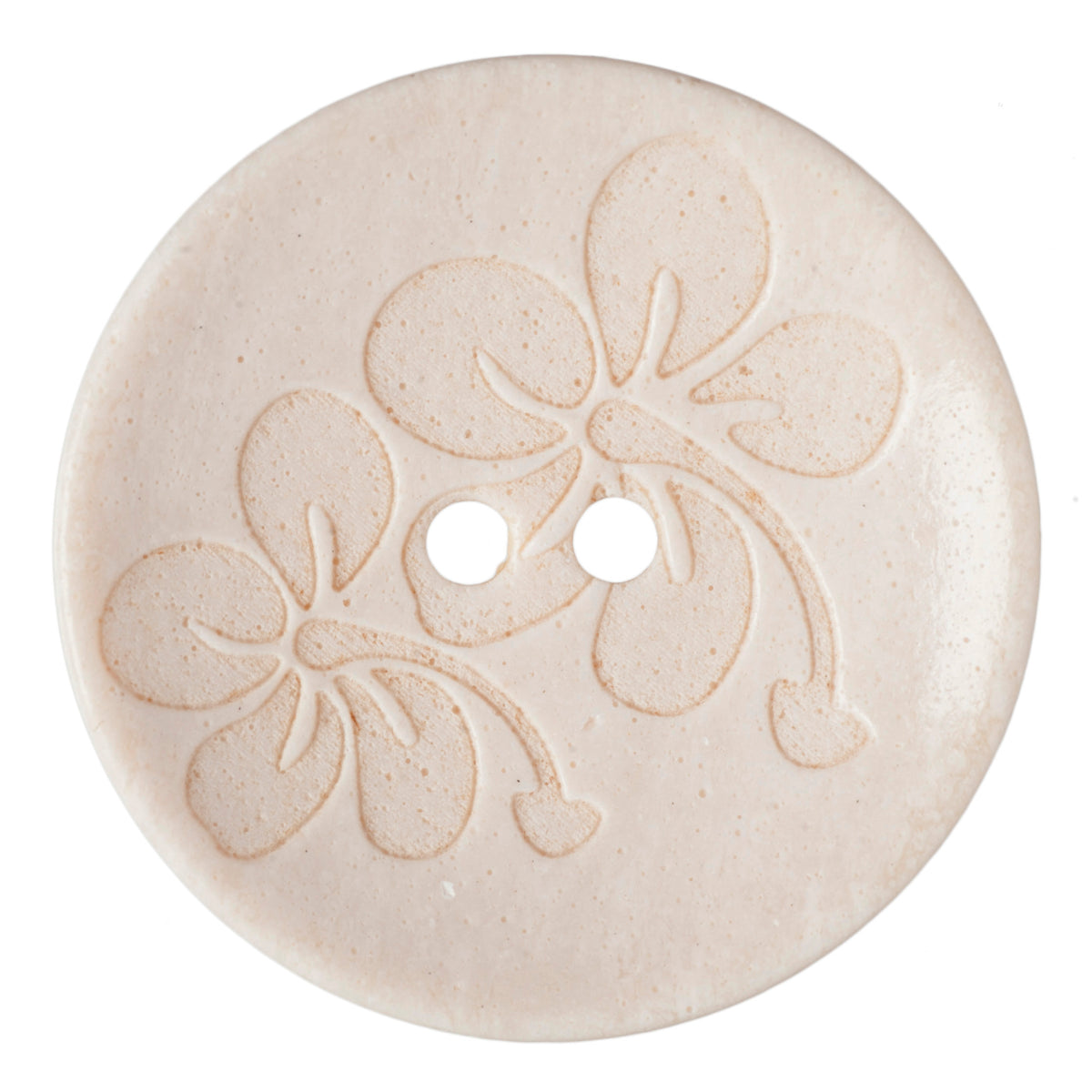 Cream button with an embossed floral design