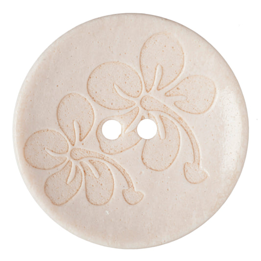 Cream button with an embossed floral design