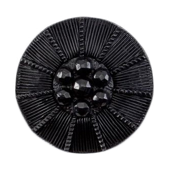 Black button with a ridged texture and a faceted centre