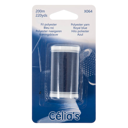 Reel of royal blue polyester thread on blue card