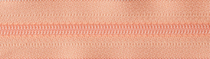 YKK 25cm nylon dress and skirt zip in bright peach